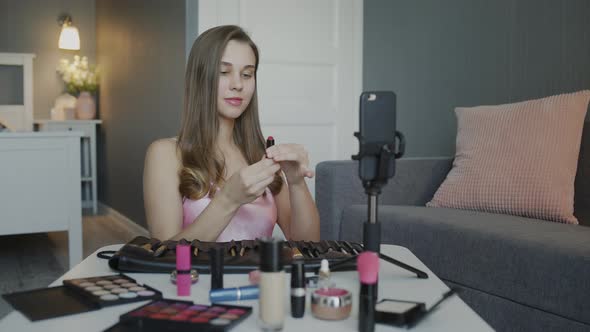 Young Beautiful Blogger Recording Her Video While Tutoring Girls About Makeup and Beauty Cosmetics