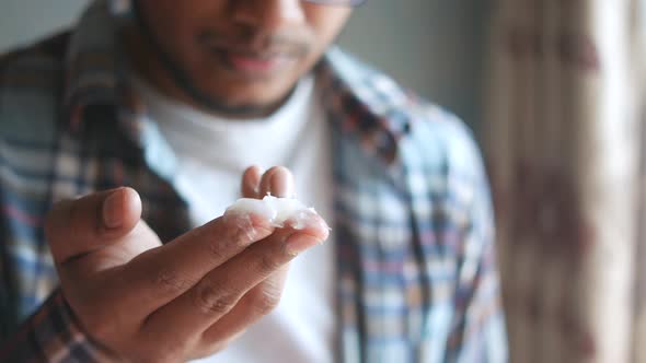 Close Up of Man Hand Using Petroleum Jelly