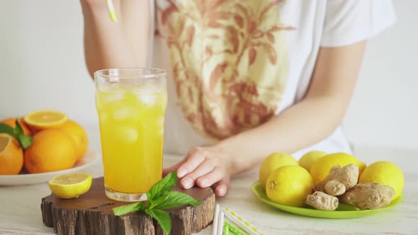 Tropical Refreshment. Summer Fruit Refreshing Drink With Lemon, Orange. Bartender Serves Lemonade