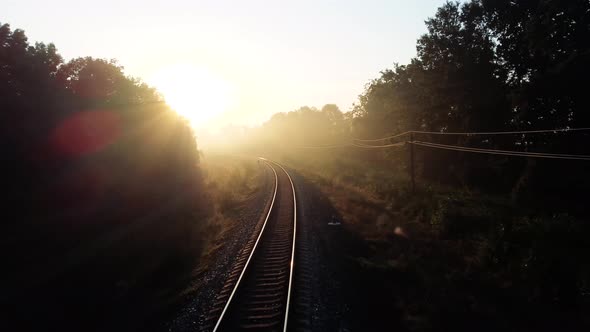 Rails in the Morning Fog and Sunlight