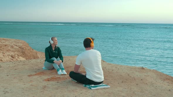 Young People Enjoying Sea View and Music