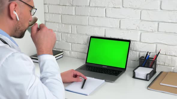 Green screen laptop concept: Medical worker listen patient drinking coffee