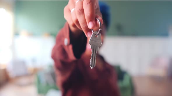 Keys to Apartment or House in Hand Woman Symbolize Renting or Buying Real Estate