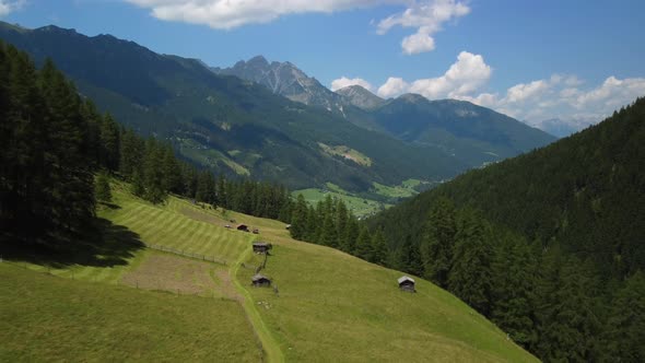 Cinematic aerial view from a drone flight over the meadows of Pinnis Valley, very close to Stubai Va