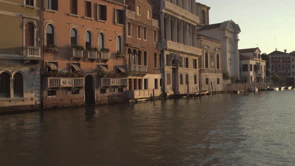Tilt up shot of Historic Palazzo Flangini Facade lit by Morning sunrise, Venice, Italy