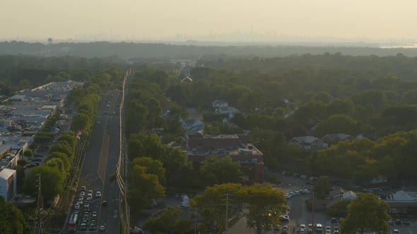 Aerial of a Small Town in Long Island and New York City Skyline Seen from Afar