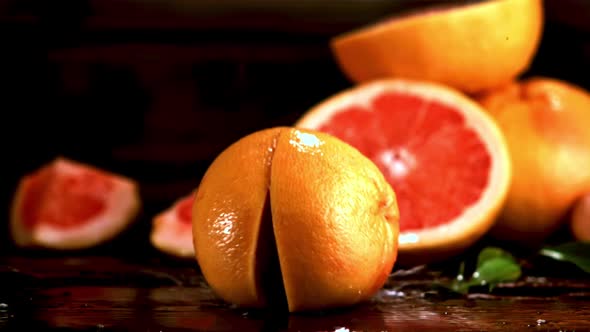 Super Slow Motion Grapefruit Falls on the Table and Splits Into Two Halves