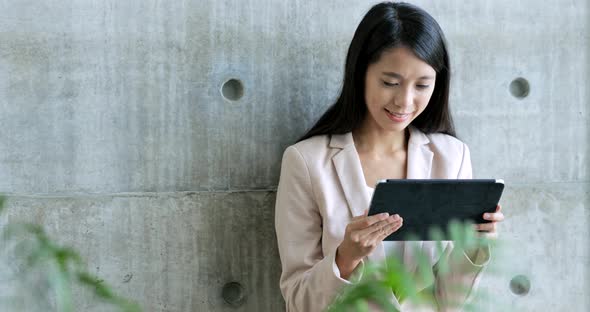 Business woman working on tablet computer 