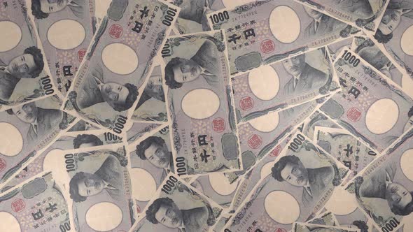 1000 Japanese yen bills background. Many banknotes.