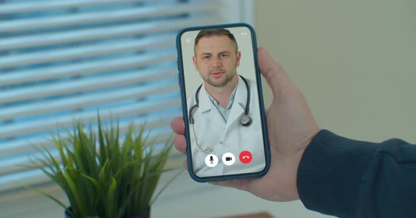 Man Checks Possible Symptoms with Professional Physician, Using Online Video Chat. Young Man Sick at