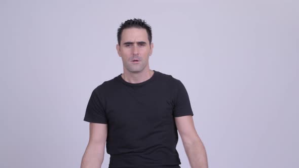 Stressed Man Getting Bad News Against White Background