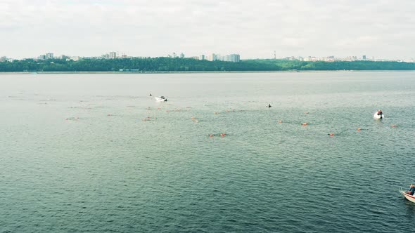 Aerial Shot of Open Water Swimmers Swimming in a River