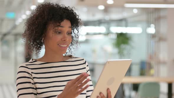 African Woman Doing Video Chat on Tablet