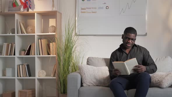 Business Reading Book Leisure Cheerful Man Couch