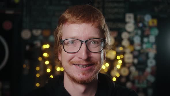 Close up portrait of attractive young irish man. Portrait of proud small business owner in cafe.