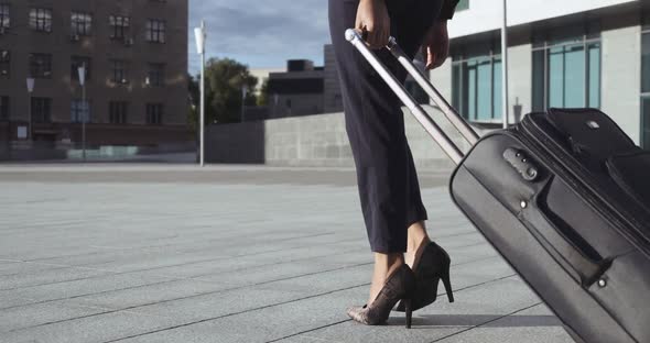 Selected Close Up of Female Legs in Classic Clothes Shoe Heels Walking on Floor, Leaving Airport