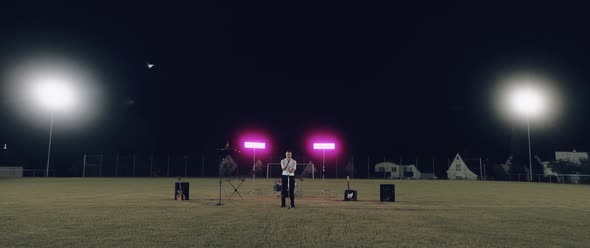 College Band playing at Night on a field