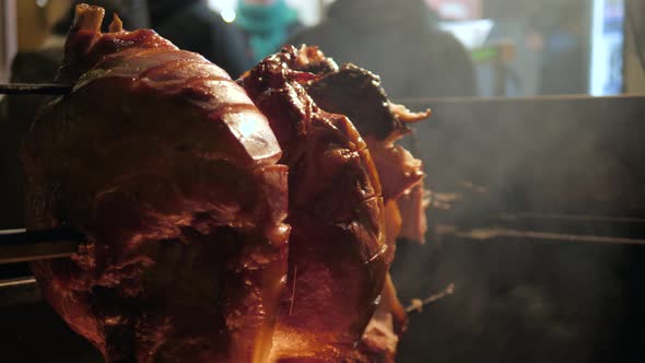 Big Piece of Meat Coocked on Open Fire and Some Pork Pieces Grilled at Historical Medieval Festival