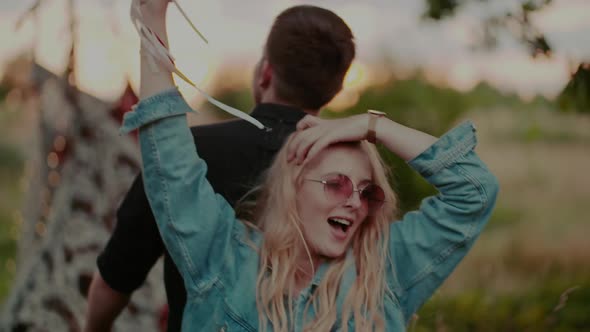 Joyful Hippie Lovers Dancing in Sunset  Freedom Concept