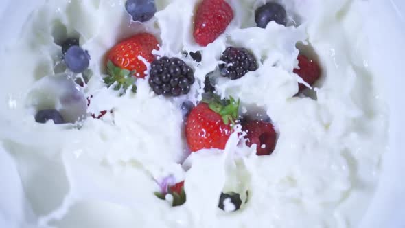 Fruit Falls in Slow Motion Into the Milk