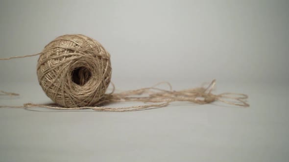 Moving skein with a natural grey background.