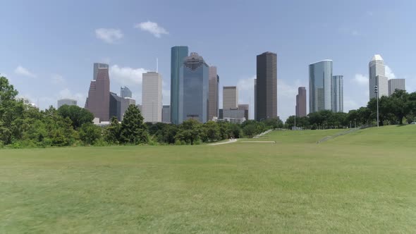 This video is about a low angle aerial view of downtown Houston from nearby park. This video was fil