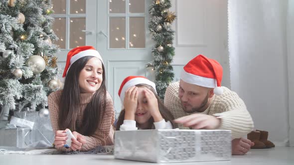 Cute Girl Gets Christmas Gift From Parents