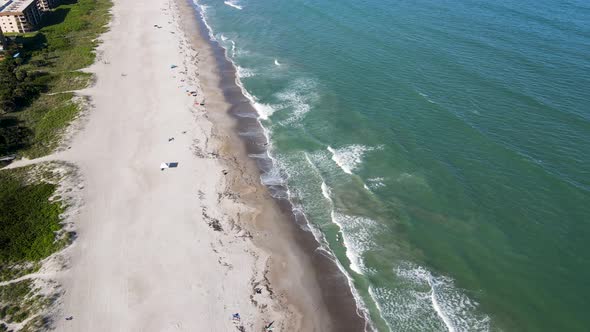 Tourists on Vacation Enjoying Sunny Florida Beach in Cocoa, Aerial