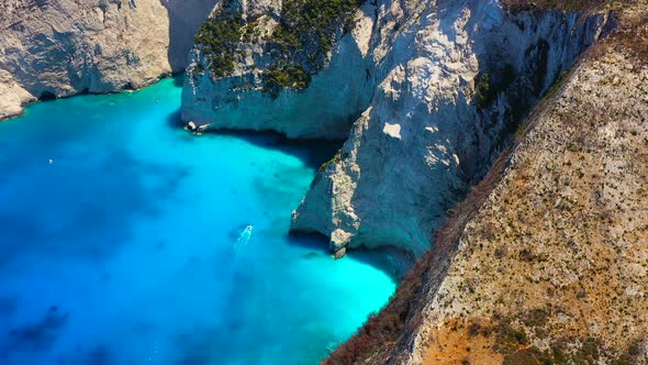 Aerial seascape at the day time. Sea bay and rocks from drone. Blue water background