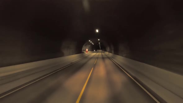 Car Кides Through the Tunnel Point-of-View Driving in Norway