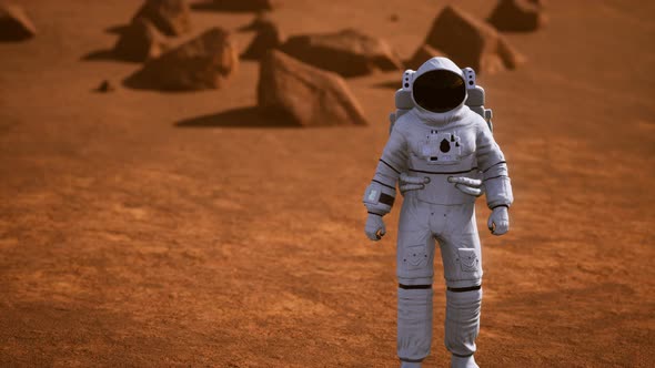 Astronaut on Mars Surface. Red Planet Covered in Gas and Rock alt