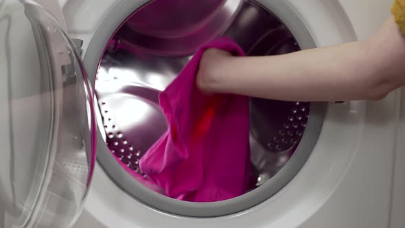 Putting the Dirty Clothes To the Washing Machine, in the Laundry, Washday, Using the Washer