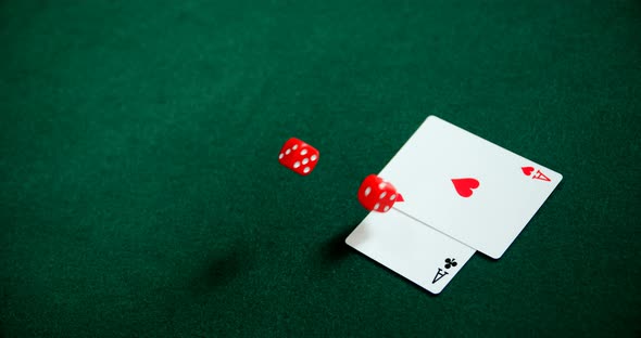 Pair of dice and playing cards on poker table 4k