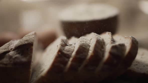 Close Up of Freshly Baked Bread is Sprinkling with Flour