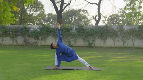 Yoga is being done by an Indian man