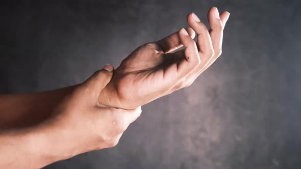 Man Suffering Pain in Hand Close Up