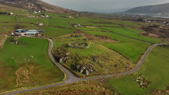 Leacanabuaile Ringfort, Kerry, Ireland, March 2022. Drone orbits the ancient stone monument from the