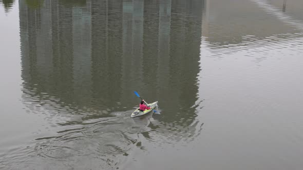 Kayaking in downtown Columbus, Ohio on the Scioto River on a misty day.