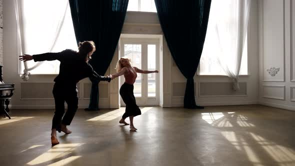 Dancing Pair is Rehearsing Contemporary Choreography Woman and Man are Dancing Together