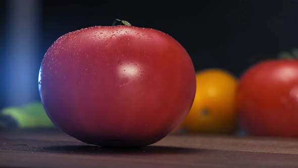 Delicious Tomato of Red Colour Falls on Brown Wooden Table