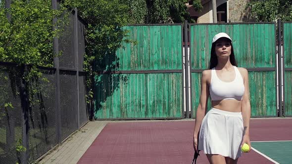 Crop Woman Playing Tennis on Court