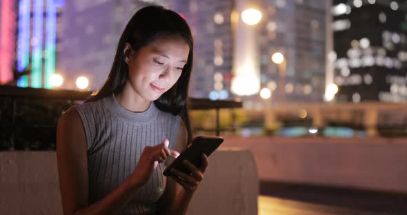 Woman use of cellphone at night 