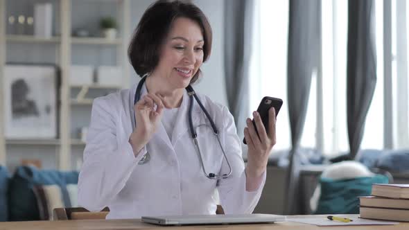 Online Video Chat By Old Lady Doctor Via Smartphone