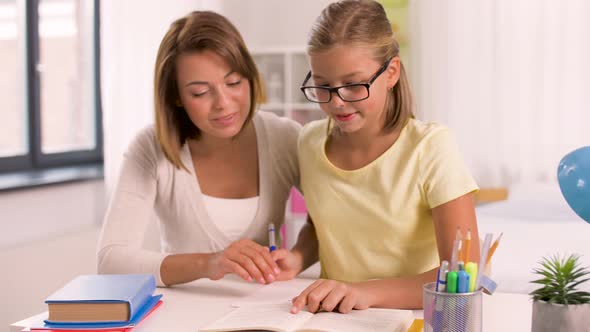 Mother and Daughter Doing Homework Together 4