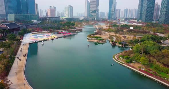 Aerial view of modern city skyline and lake park