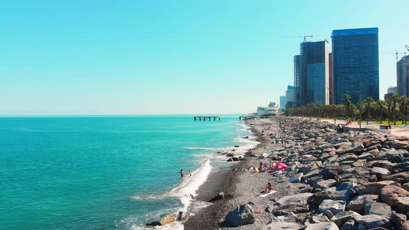 Tourist On Rocky Black Sea Beach Enjoy Vacation