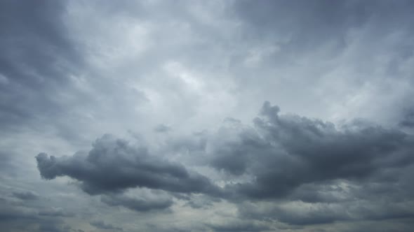 Dramatic sky with storm cloud on a cloudy day time lapse. alt