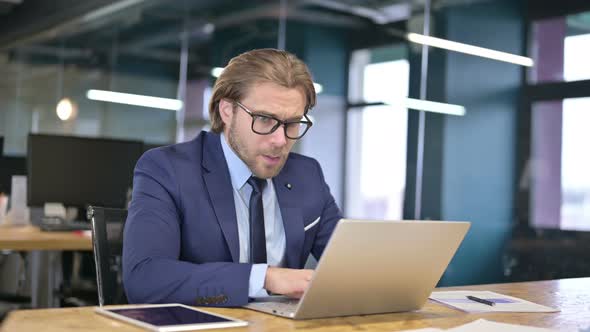 Shocked Businessman Wondering in Awe at Work