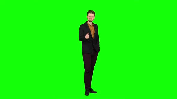 Male Businessman Showing Thumbs Up, He Likes Everything. Green Screen