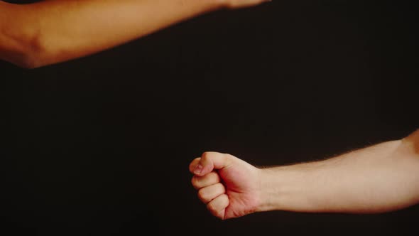 Diverse People Making Handshake Gesture with Fists Isolated on Black Background